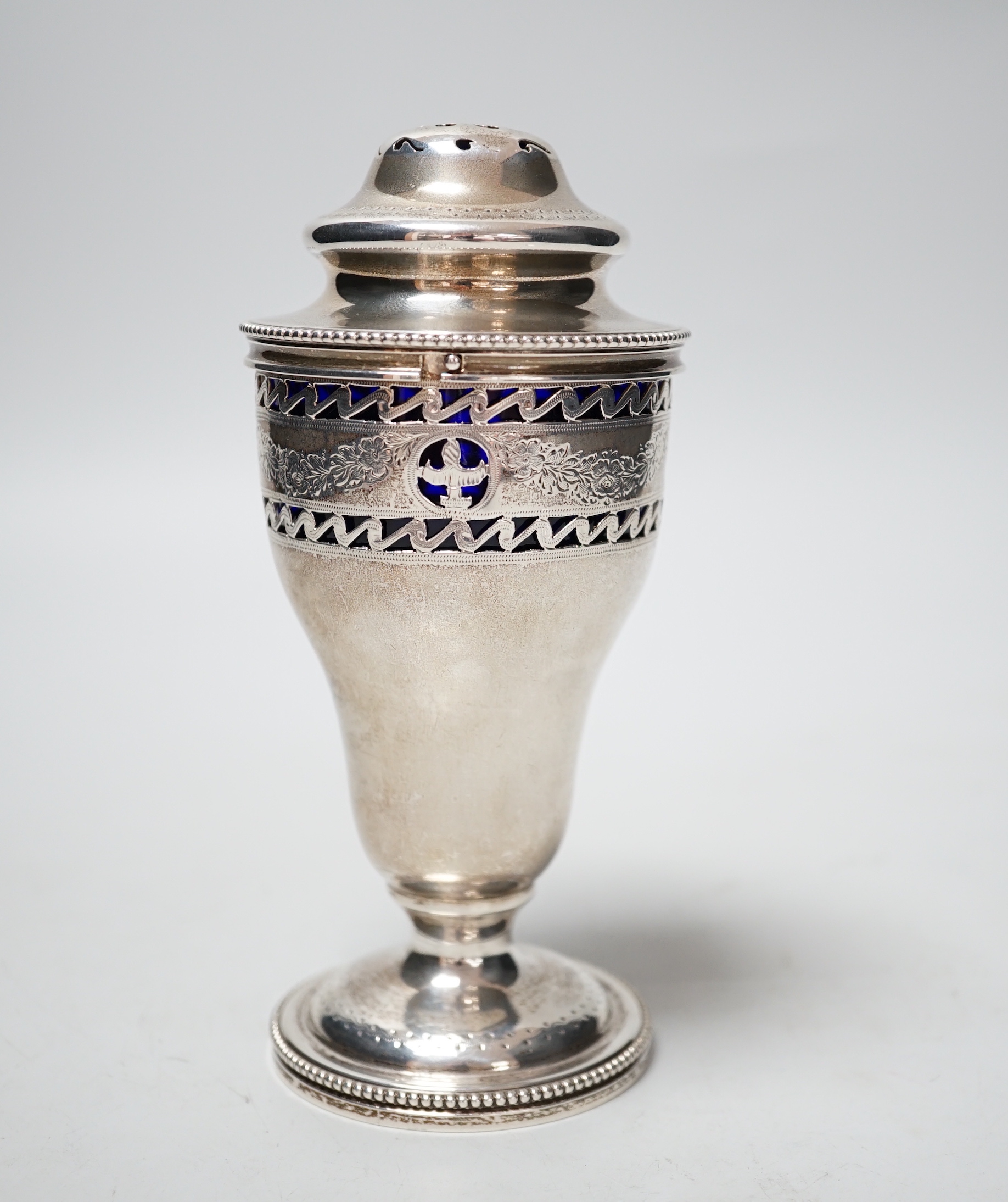 An Edwardian pierced silver sugar sifter, with blue glass liner, Charles Stuart Harris & Sons, London, 1907, 15.2cm.